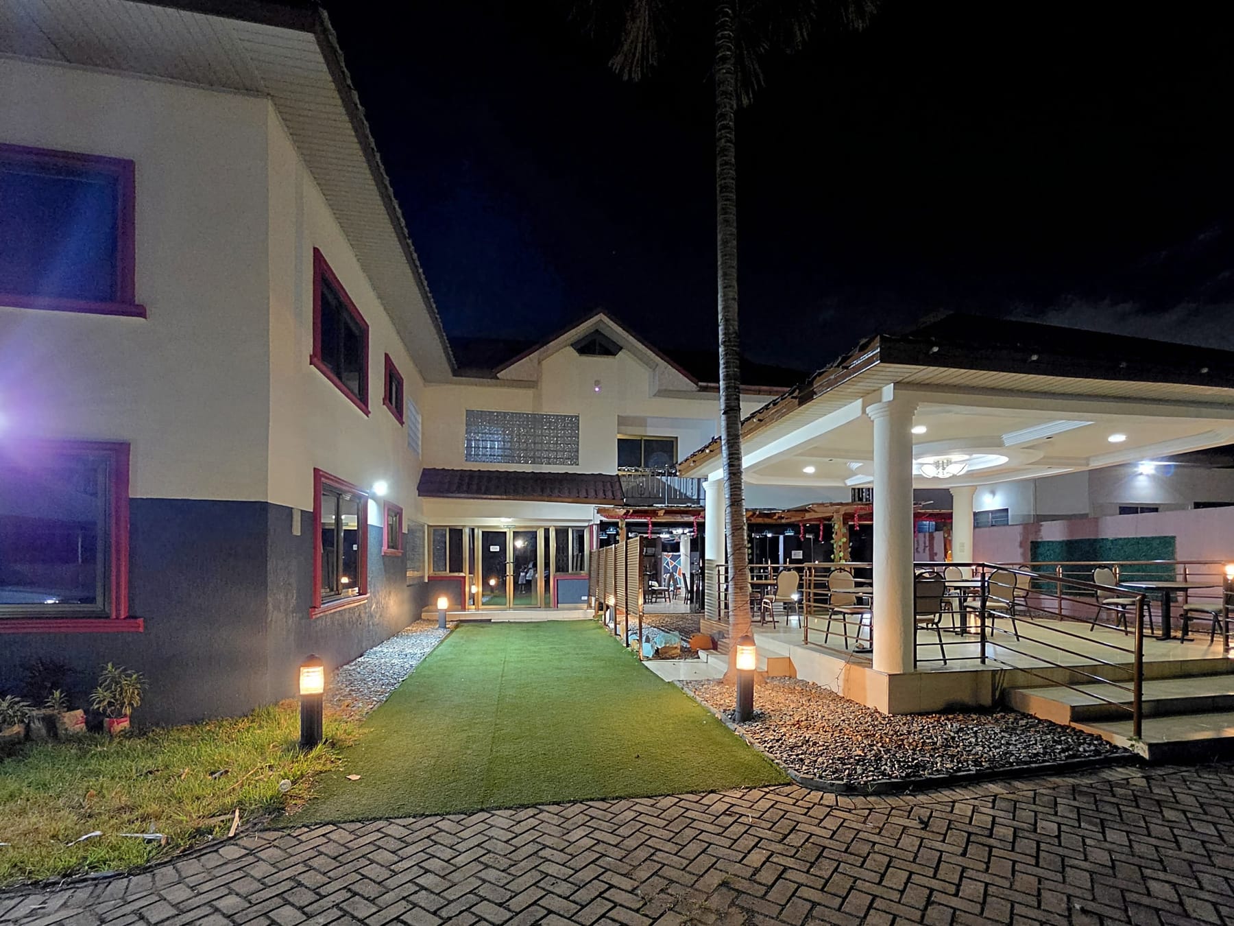 The lawn and the covered terrace at night