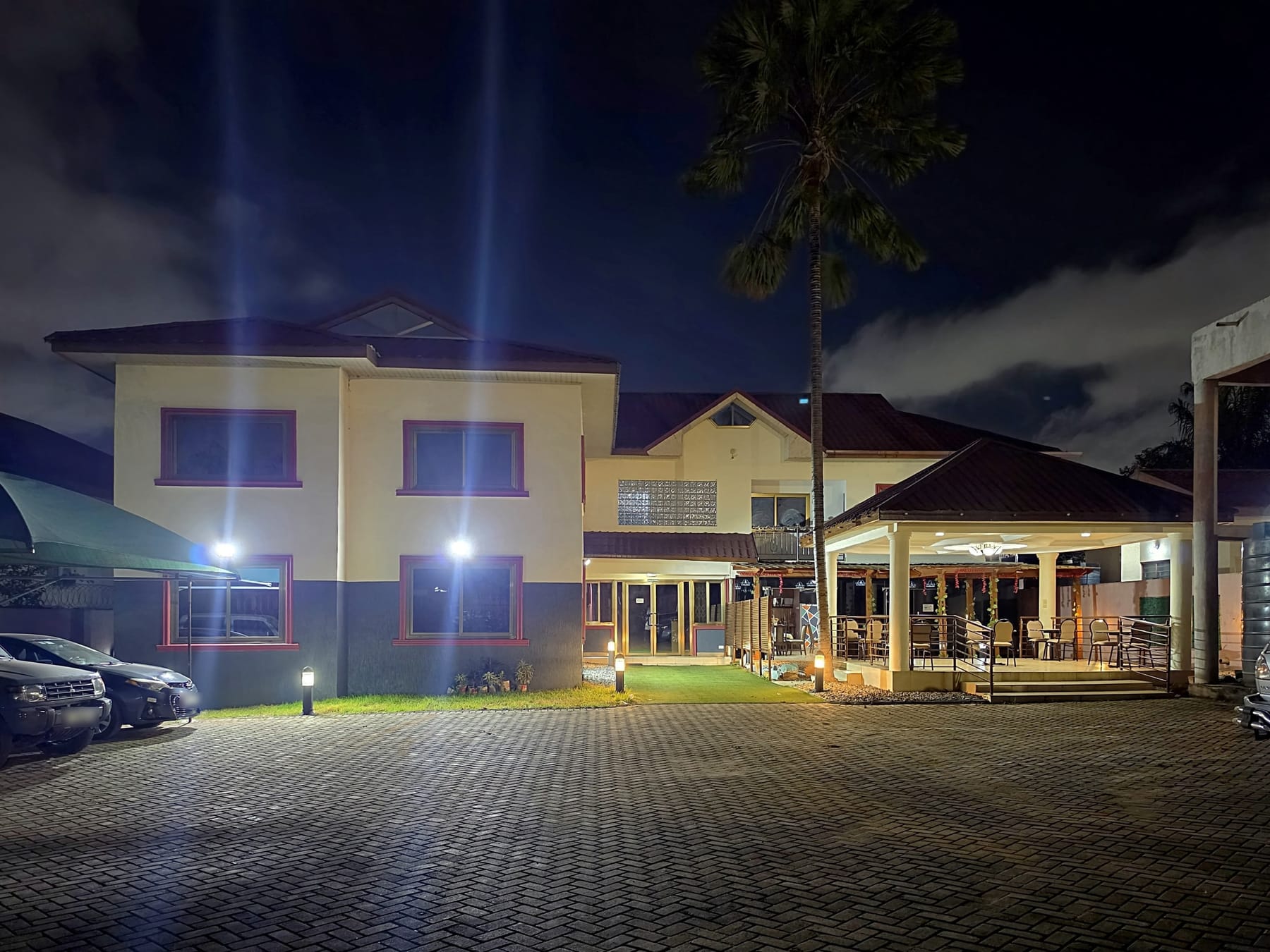 Restall Guest Lodge at night, seen from the car park